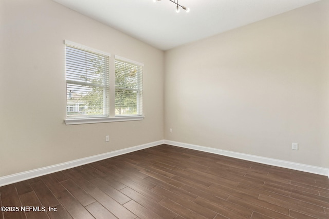 96167 Grande Oaks Ln, Fernandina Beach, FL 32034 - empty room with dark wood-style floors and baseboards