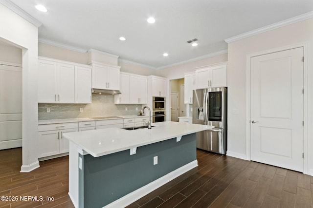 96167 Grande Oaks Ln, Fernandina Beach, FL 32034 - kitchen with stainless steel fridge with ice dispenser, a sink, dark wood finished floors, black electric cooktop, and white cabinetry
