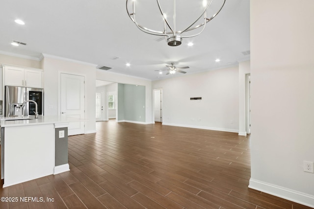 96167 Grande Oaks Ln, Fernandina Beach, FL 32034 - unfurnished living room with baseboards, ornamental molding, ceiling fan, recessed lighting, and dark wood-type flooring