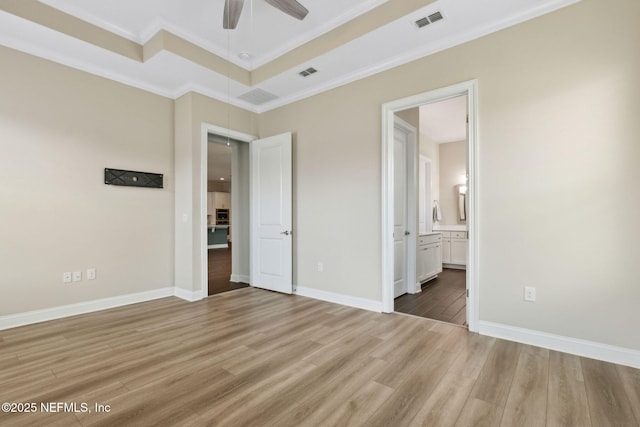 96167 Grande Oaks Ln, Fernandina Beach, FL 32034 - unfurnished bedroom with ornamental molding, light wood-style flooring, ensuite bathroom, baseboards, and a ceiling fan