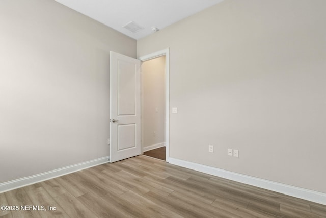 96167 Grande Oaks Ln, Fernandina Beach, FL 32034 - spare room featuring wood finished floors and baseboards