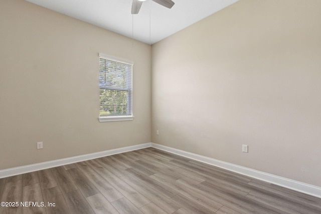 96167 Grande Oaks Ln, Fernandina Beach, FL 32034 - spare room featuring wood finished floors, ceiling fan, and baseboards