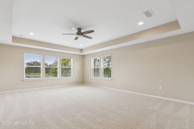 96167 Grande Oaks Ln, Fernandina Beach, FL 32034 - carpeted spare room with a raised ceiling, a ceiling fan, baseboards, and recessed lighting