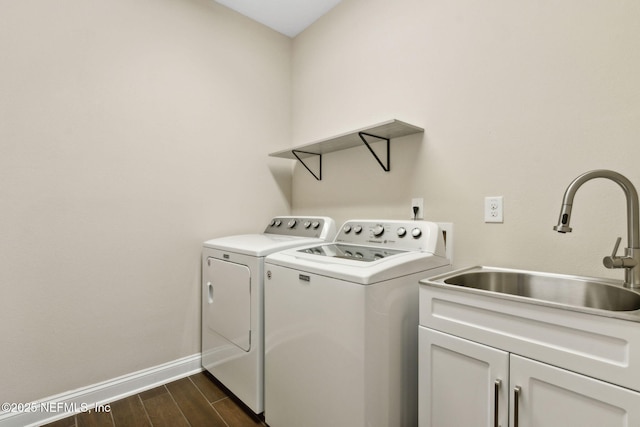 96167 Grande Oaks Ln, Fernandina Beach, FL 32034 - laundry area featuring washing machine and clothes dryer, cabinet space, baseboards, and dark wood-style floors
