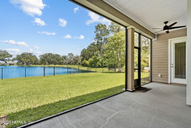 96167 Grande Oaks Ln, Fernandina Beach, FL 32034 - unfurnished sunroom featuring a ceiling fan and a water view