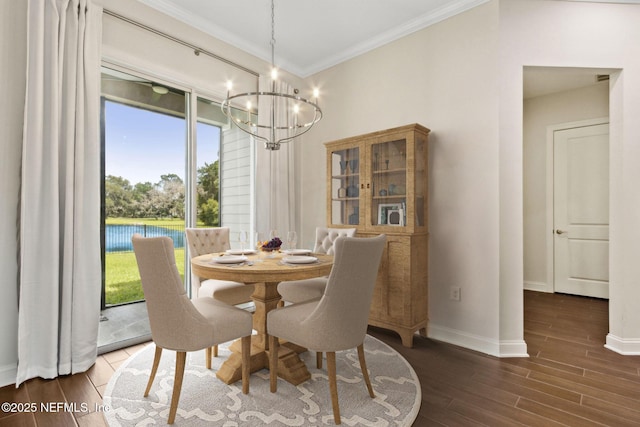 96167 Grande Oaks Ln, Fernandina Beach, FL 32034 - dining space featuring a chandelier, wood finished floors, crown molding, baseboards, and plenty of natural light