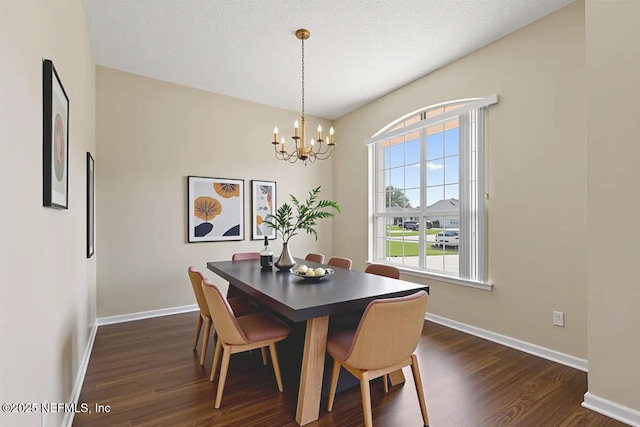 639 English Meadows Ct, Orange Park, FL 32073 - dining space with a chandelier, dark wood finished floors, and baseboards