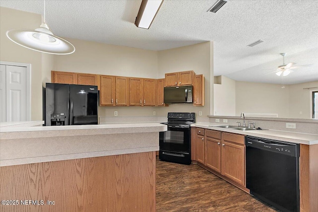 639 English Meadows Ct, Orange Park, FL 32073 - kitchen with black appliances, a sink, a peninsula, dark wood-style flooring, and light countertops
