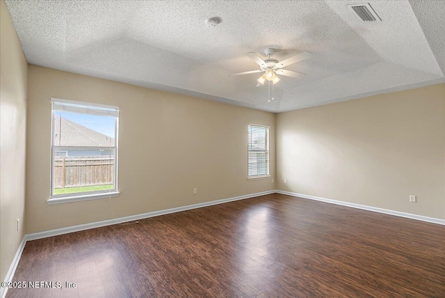 639 English Meadows Ct, Orange Park, FL 32073 - unfurnished room featuring dark wood-style floors, a ceiling fan, a textured ceiling, baseboards, and a smoke detector