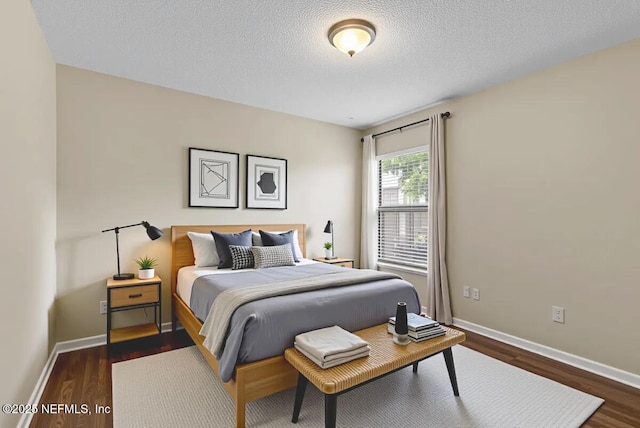 639 English Meadows Ct, Orange Park, FL 32073 - bedroom with dark wood-type flooring, baseboards, and a textured ceiling