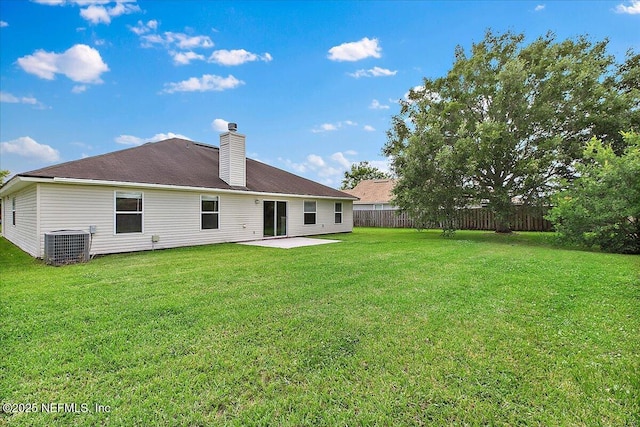 5631 Ortega Park Blvd, Jacksonville, FL 32244 - back of property featuring a patio area, a chimney, and central AC