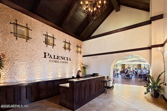 2538 Las Calinas Blvd, Saint Augustine, FL 32095 - reception area featuring high vaulted ceiling, a chandelier, arched walkways, and wooden ceiling with exposed beams