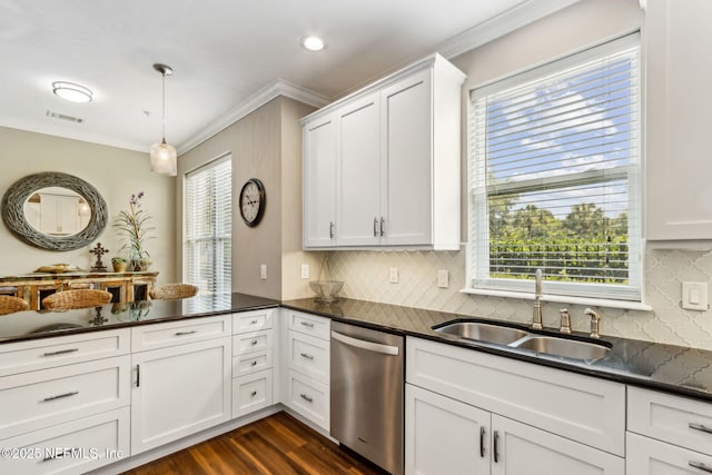 1899 White Sands Way Unit 704, Fernandina Beach, FL 32034 - kitchen with dishwasher, crown molding, dark countertops, a sink, and plenty of natural light