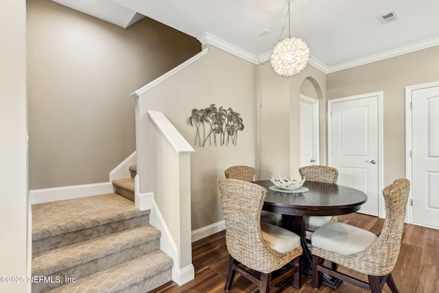 1899 White Sands Way Unit 704, Fernandina Beach, FL 32034 - dining room with wood finished floors, arched walkways, stairway, ornamental molding, and baseboards