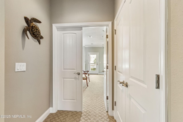 1899 White Sands Way Unit 704, Fernandina Beach, FL 32034 - corridor with baseboards and light colored carpet