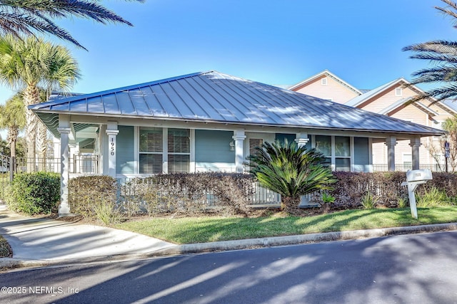 1899 White Sands Way Unit 704, Fernandina Beach, FL 32034 - view of front of property featuring a standing seam roof, a porch, and metal roof