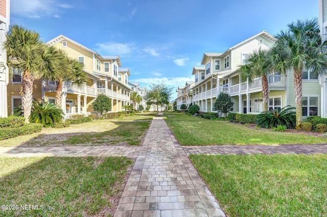 1899 White Sands Way Unit 704, Fernandina Beach, FL 32034 - surrounding community with a residential view and a lawn