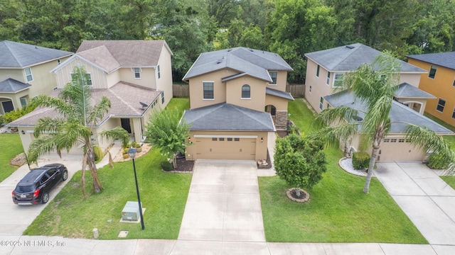 203 Buck Run Way, Saint Augustine, FL 32092 - view of front of house with a garage, concrete driveway, stucco siding, a residential view, and a front yard