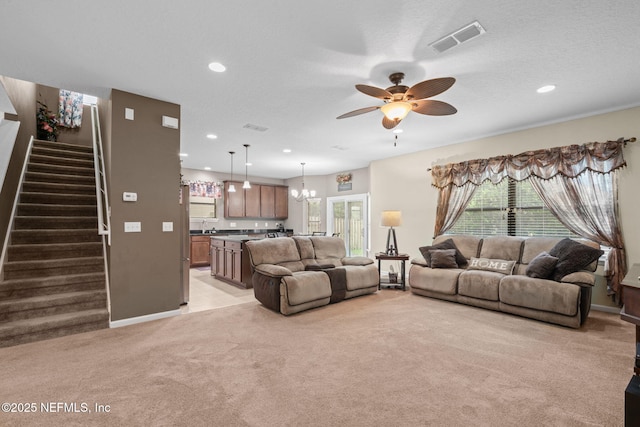 203 Buck Run Way, Saint Augustine, FL 32092 - living area with light colored carpet, stairway, a ceiling fan, a chandelier, and recessed lighting
