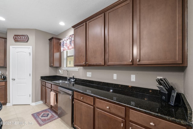 203 Buck Run Way, Saint Augustine, FL 32092 - kitchen with stainless steel dishwasher, dark stone countertops, light tile patterned floors, and recessed lighting