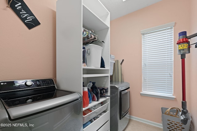203 Buck Run Way, Saint Augustine, FL 32092 - washroom featuring independent washer and dryer and light tile patterned floors