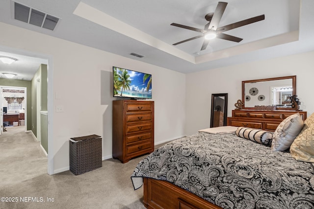 203 Buck Run Way, Saint Augustine, FL 32092 - bedroom with light colored carpet, a tray ceiling, and a ceiling fan