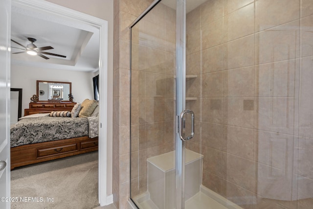 203 Buck Run Way, Saint Augustine, FL 32092 - ensuite bathroom with a ceiling fan, a stall shower, and a tray ceiling
