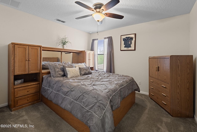 203 Buck Run Way, Saint Augustine, FL 32092 - bedroom with dark carpet, a textured ceiling, and a ceiling fan