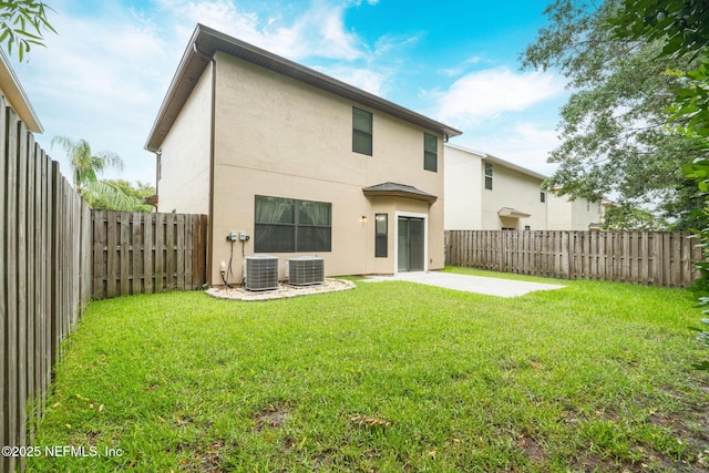 203 Buck Run Way, Saint Augustine, FL 32092 - back of house with stucco siding, a patio, and a fenced backyard