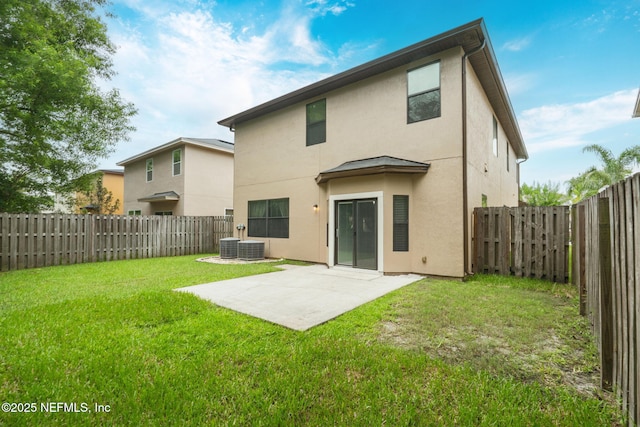 203 Buck Run Way, Saint Augustine, FL 32092 - rear view of house with stucco siding, a patio, and a fenced backyard