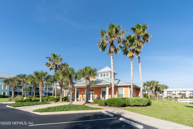 225 Atlantis Cir Unit 101-A, Saint Augustine Beach, FL 32080 - view of building exterior with uncovered parking