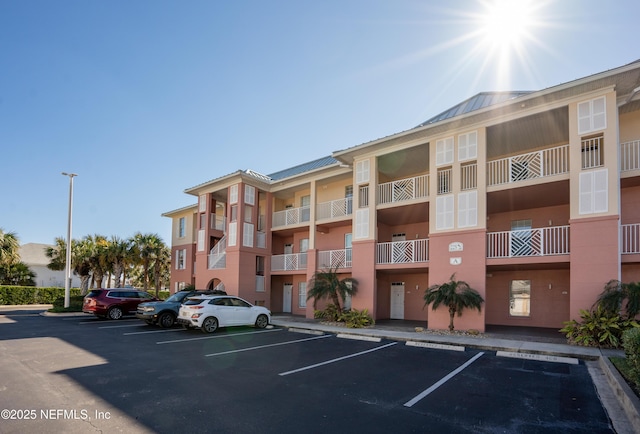 225 Atlantis Cir Unit 101-A, Saint Augustine Beach, FL 32080 - view of apartment building / complex featuring uncovered parking