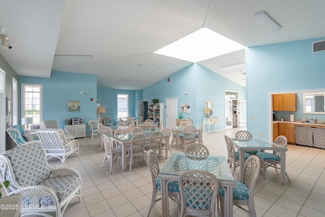 225 Atlantis Cir Unit 101-A, Saint Augustine Beach, FL 32080 - dining room with light tile patterned floors and high vaulted ceiling