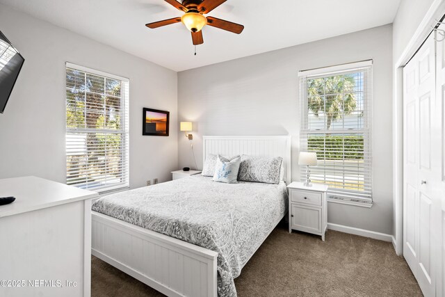 225 Atlantis Cir Unit 101-A, Saint Augustine Beach, FL 32080 - carpeted bedroom with baseboards, a closet, and a ceiling fan