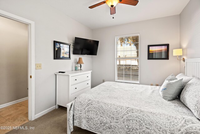 225 Atlantis Cir Unit 101-A, Saint Augustine Beach, FL 32080 - bedroom featuring baseboards, a ceiling fan, and light colored carpet