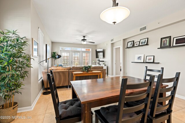 225 Atlantis Cir Unit 101-A, Saint Augustine Beach, FL 32080 - dining space featuring light tile patterned floors, ceiling fan, and baseboards