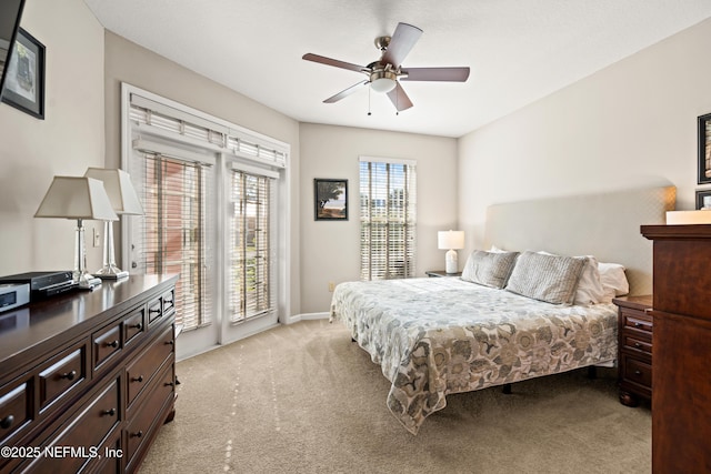 225 Atlantis Cir Unit 101-A, Saint Augustine Beach, FL 32080 - bedroom featuring light carpet, access to exterior, a ceiling fan, and baseboards