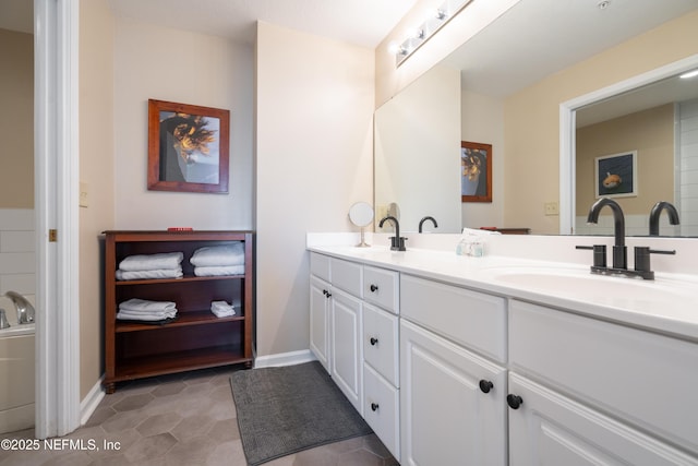 225 Atlantis Cir Unit 101-A, Saint Augustine Beach, FL 32080 - full bathroom featuring double vanity, tile patterned flooring, and baseboards