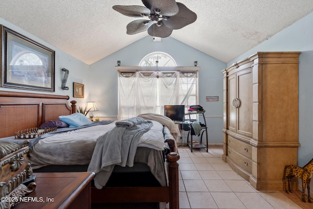 1942 Calusa Trl, Middleburg, FL 32068 - bedroom featuring light tile patterned floors, a textured ceiling, vaulted ceiling, and a ceiling fan