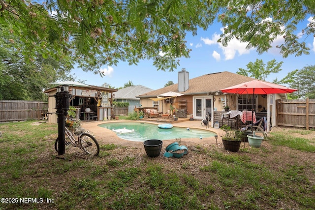 1942 Calusa Trl, Middleburg, FL 32068 - view of swimming pool with french doors, a fenced backyard, and a patio