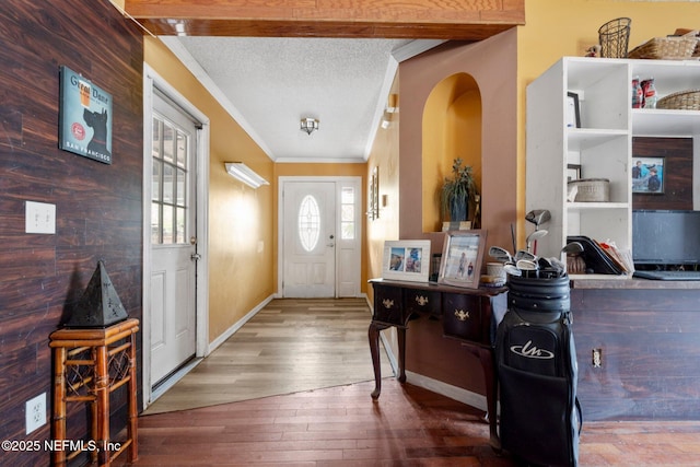 1942 Calusa Trl, Middleburg, FL 32068 - foyer featuring ornamental molding, wood-type flooring, a textured ceiling, and baseboards