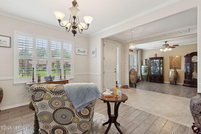 3592 Harrier Ct, Middleburg, FL 32068 - dining space featuring wood finish floors, a chandelier, ornamental molding, and a ceiling fan