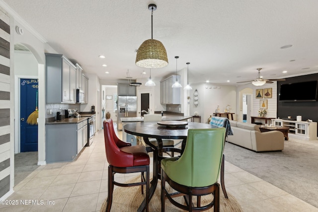 3592 Harrier Ct, Middleburg, FL 32068 - dining area featuring light tile patterned floors, a ceiling fan, light carpet, recessed lighting, and a textured ceiling