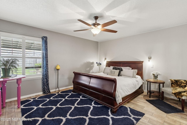 3592 Harrier Ct, Middleburg, FL 32068 - bedroom featuring wood finished floors, ceiling fan, and a textured ceiling