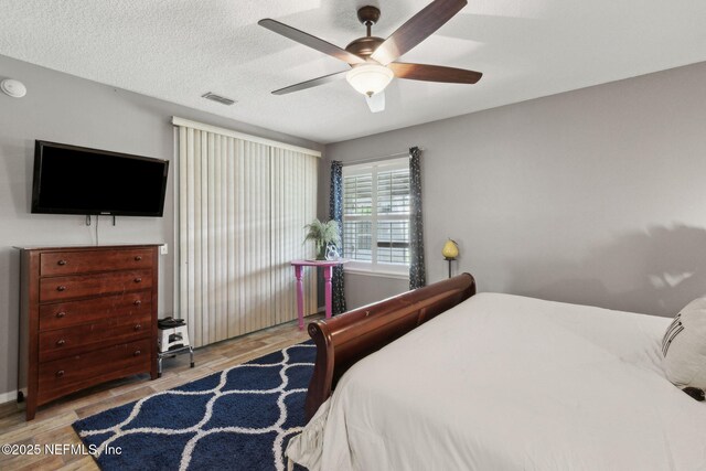 3592 Harrier Ct, Middleburg, FL 32068 - bedroom featuring wood finished floors and a ceiling fan