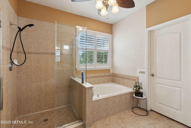 3592 Harrier Ct, Middleburg, FL 32068 - bathroom with a stall shower, a garden tub, ceiling fan, and tile patterned floors