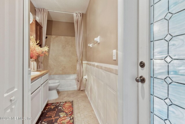 3592 Harrier Ct, Middleburg, FL 32068 - bathroom with tile patterned floors, vanity, shower / bath combination with curtain, and tile walls