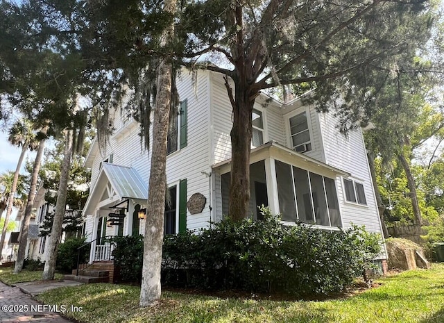 5 Palm Row, Saint Augustine, FL 32084 - view of property exterior featuring a sunroom