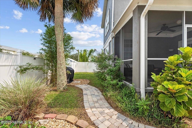 28 S Comares Ave, Saint Augustine Beach, FL 32080 - fenced backyard with a sunroom
