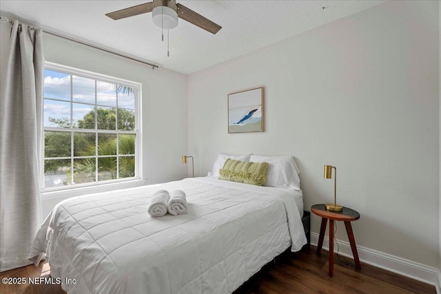 28 S Comares Ave, Saint Augustine Beach, FL 32080 - bedroom featuring wood finished floors, baseboards, and a ceiling fan